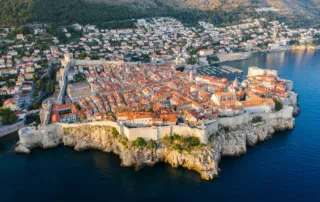Aerial view of Dubrovnik city bulidings near body of water during daytime